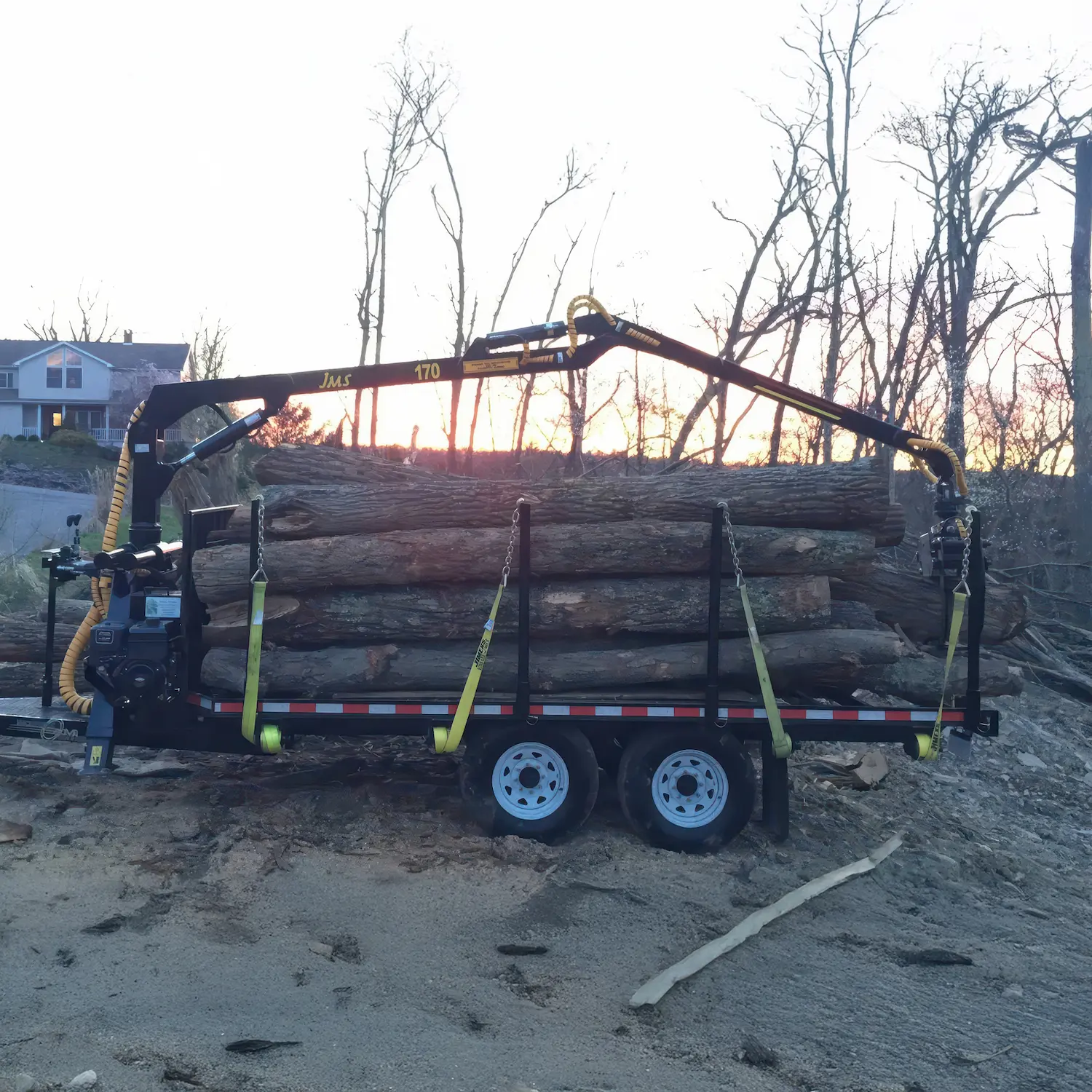 AM Machinery RFR 07 road log trailer loaded with timber at golden hour