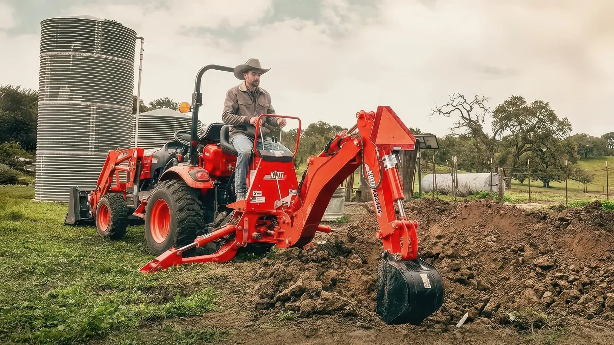 KIOTI compact tractor with front loader and KB2465 backhoe